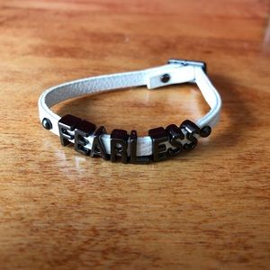NWOT BCBG white Fearless bracelet.
